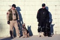 Iraqi Policeman leashing his K9 dog Royalty Free Stock Photo